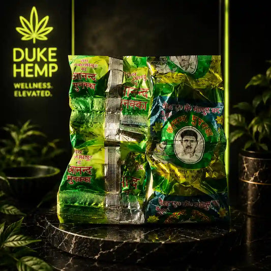 Anand Munakka Bhang Goli premium product packaging by Duke Hemp on luxury black marble background