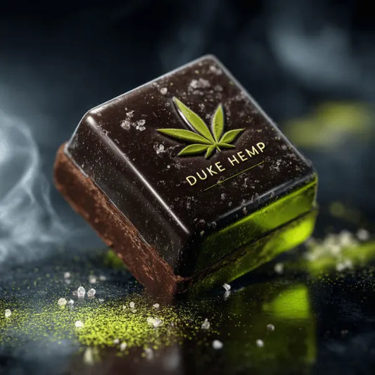 Macro close-up of Duke Hemp bhang chocolate cube with cannabis leaf branding