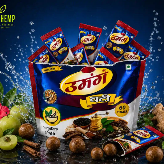Opened Umang Vati Ayurvedic stand-up pouch with individual sachets, traditional Ayurvedic munakka vati balls, fresh herbs, and premium water splash studio background.